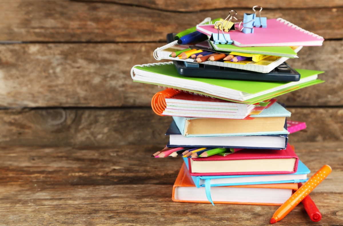 stack of old notebooks toss these things from your house for instant happiness