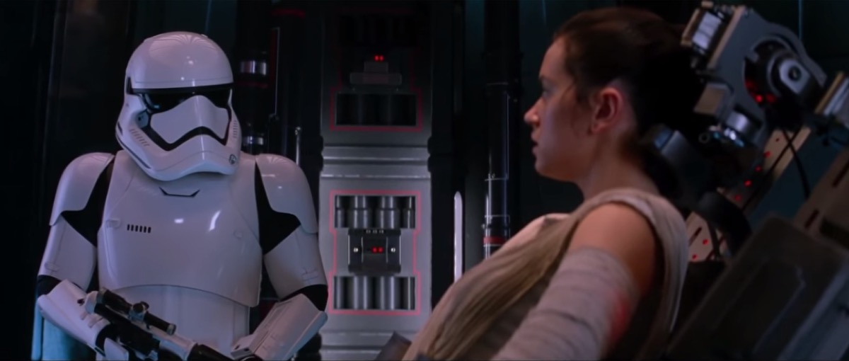 a storm trooper standing holding a girl captive