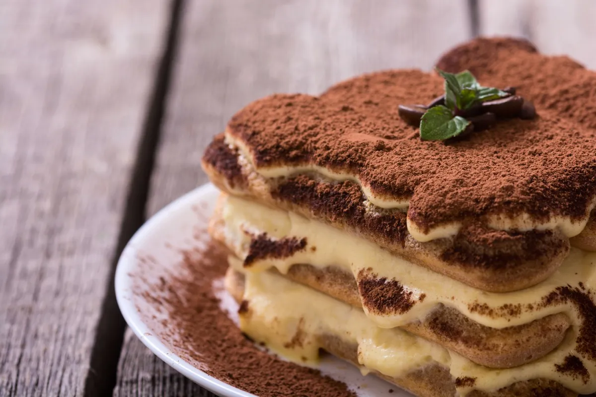 Homemade tiramisu cake . Sweet Italian dessert . Food background