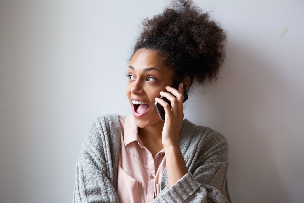 woman laughing on the phone