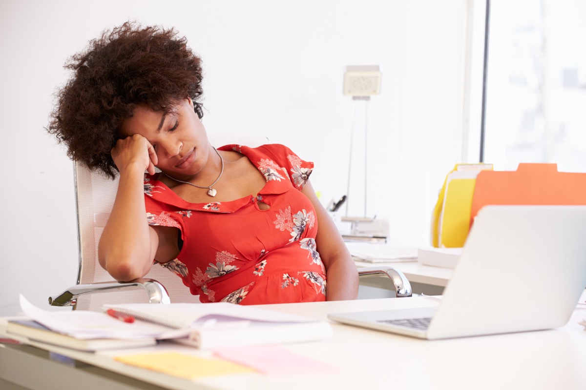 woman sleeping at her desk