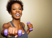 Woman working out lifting weights, home hazards
