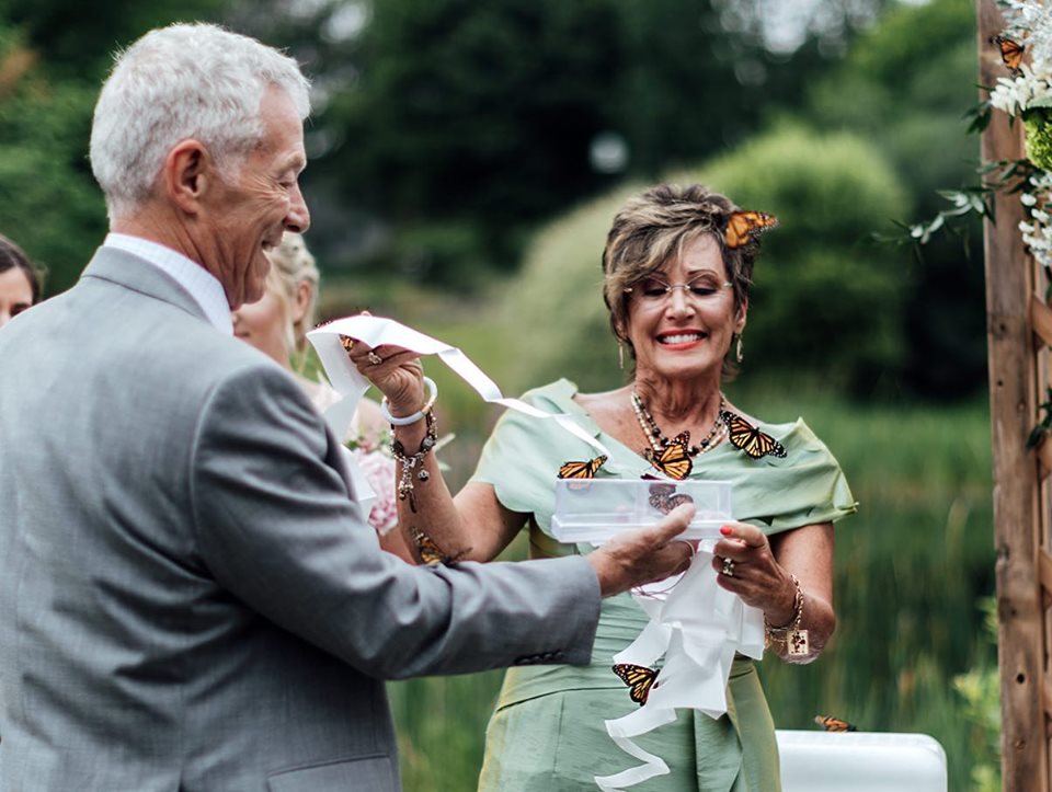 family releases butterflies at wedding in honor of late sister
