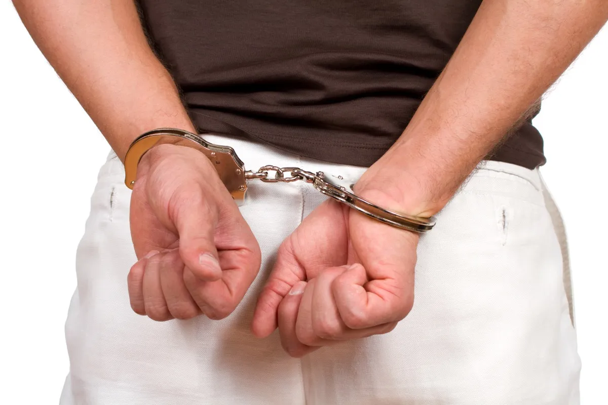 Person in Handcuffs Under Arrest