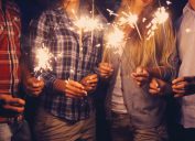 people holding sparklers outside, bug products