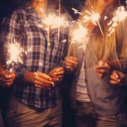 people holding sparklers outside, bug products