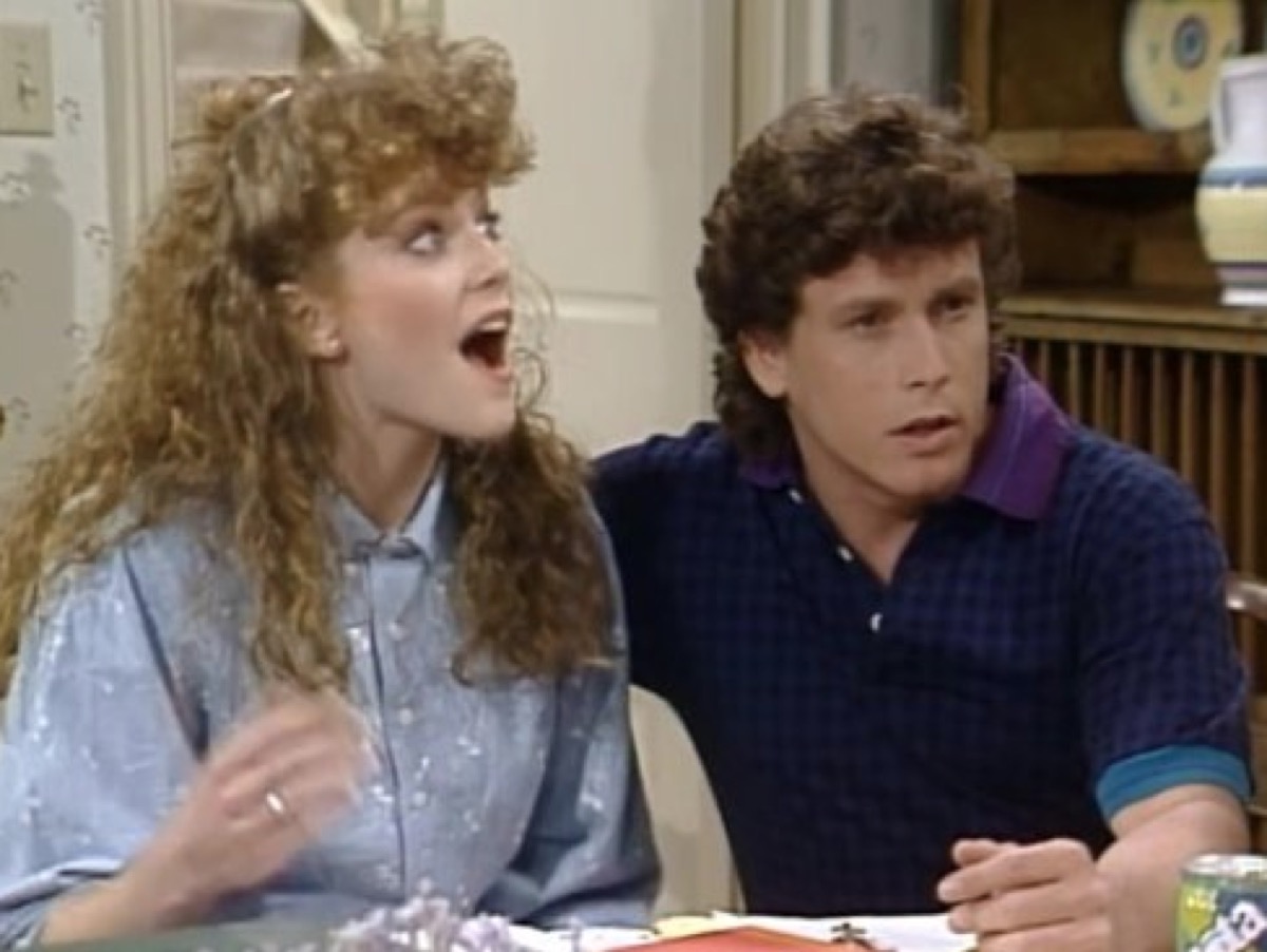two characters from "Charles In Charge" sitting at the table with a shocked look on their faces 