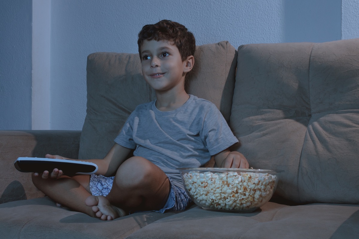 Child Watching TV and Eating Popcorn Late at Night Lies Ex-Spouses