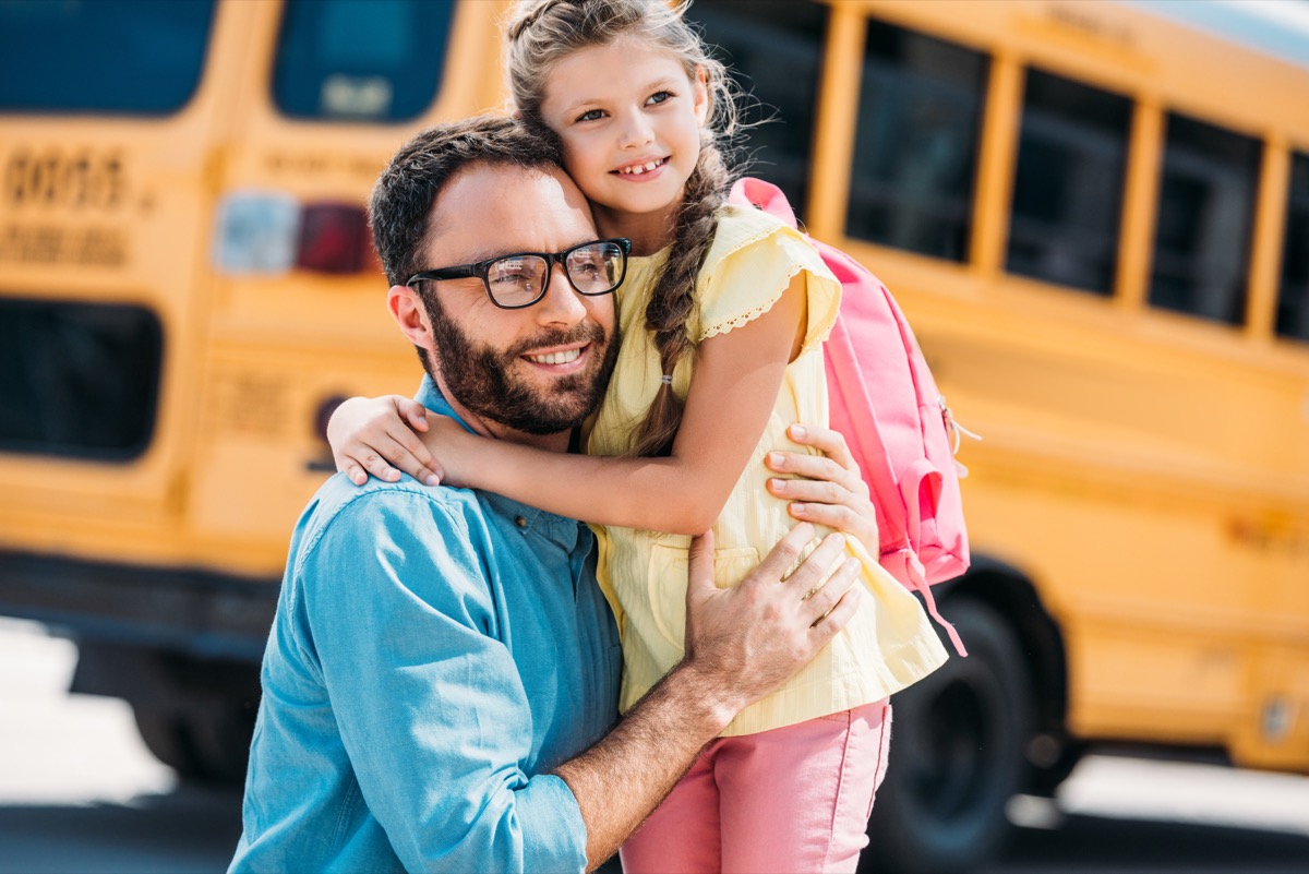 dad and daughter outside of school back-to-school tips