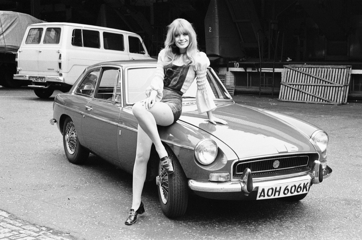 emma vincent leaning on a reveille car in the 1970s