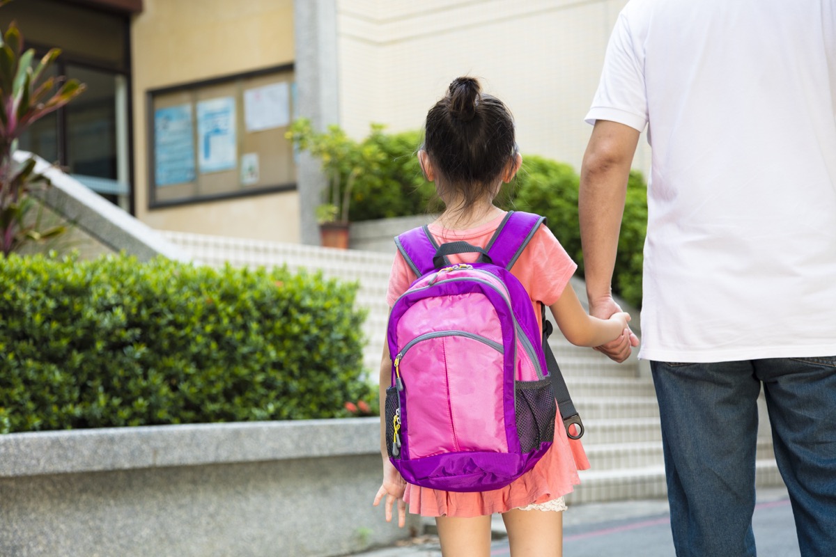 father walking child to school back-to-school tips