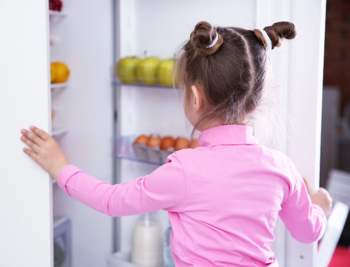 girl opening refrigerator back-to-school tips