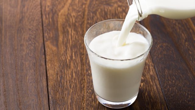 Pouring a Glass of Milk Food Bad for Cats