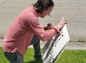 Keanu Reeves signs You're Beautiful poster for Louisiana family, the Hunts