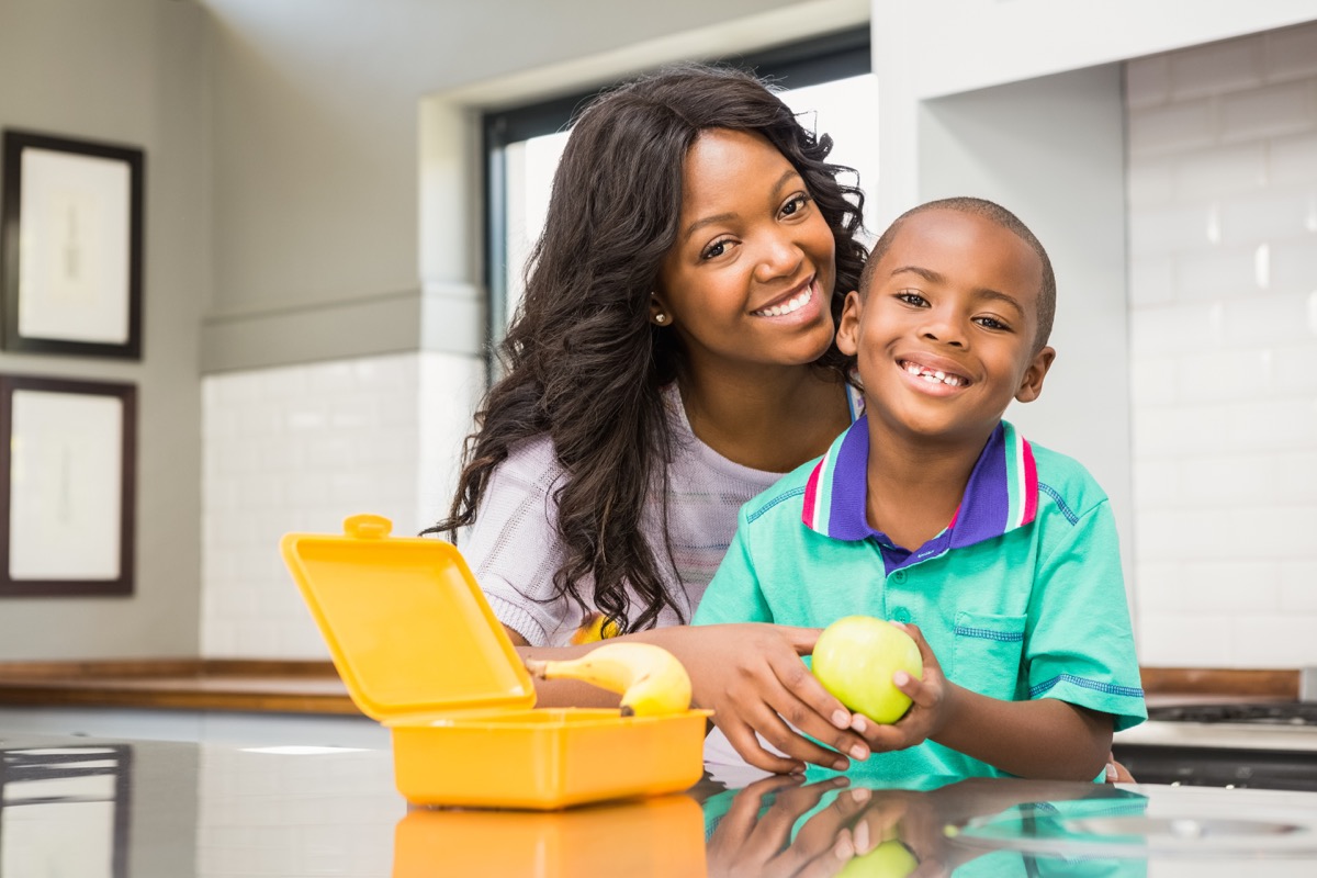 mother and son packing lunch back-to-school tips