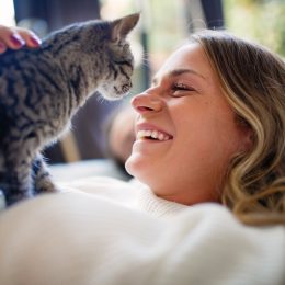 owner laughing with her cat