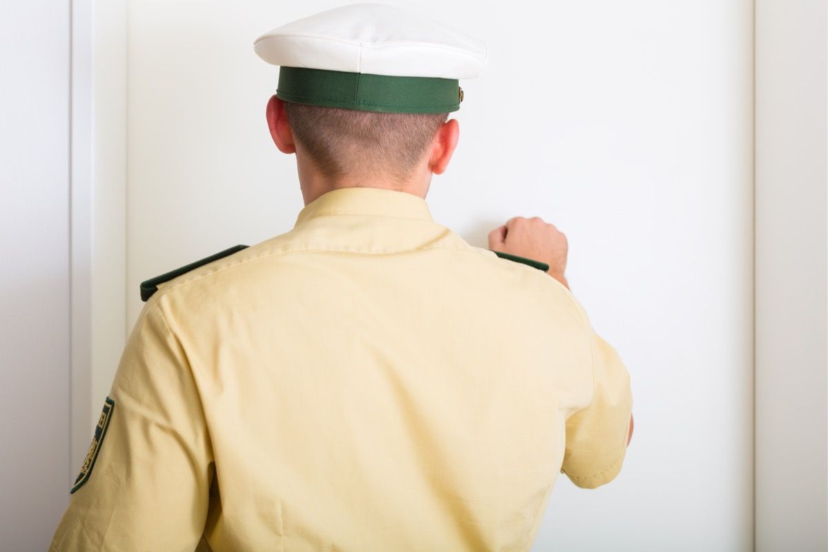 Police Officer Knocking on a Door