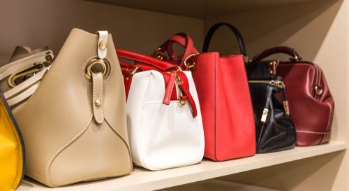 Row of Purses Sitting in a Closet Ways You Ruin Clothing