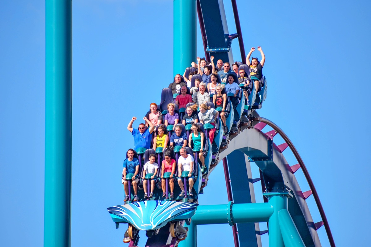 People on a roller coaster ride in Orlando Florida at disney world