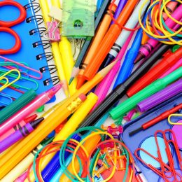 school supplies pile paper clips scissors pencils markers