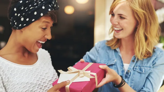 woman giving her friend a gift, best friend gifts