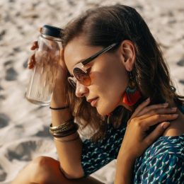 woman on beach in warm weather, cooling products