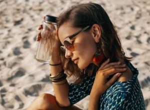woman on beach in warm weather, cooling products