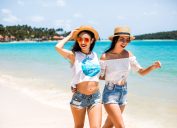 two women on the beach in straw hats, cheap summer hats