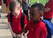 viral photo of boy comforting classmate with autism