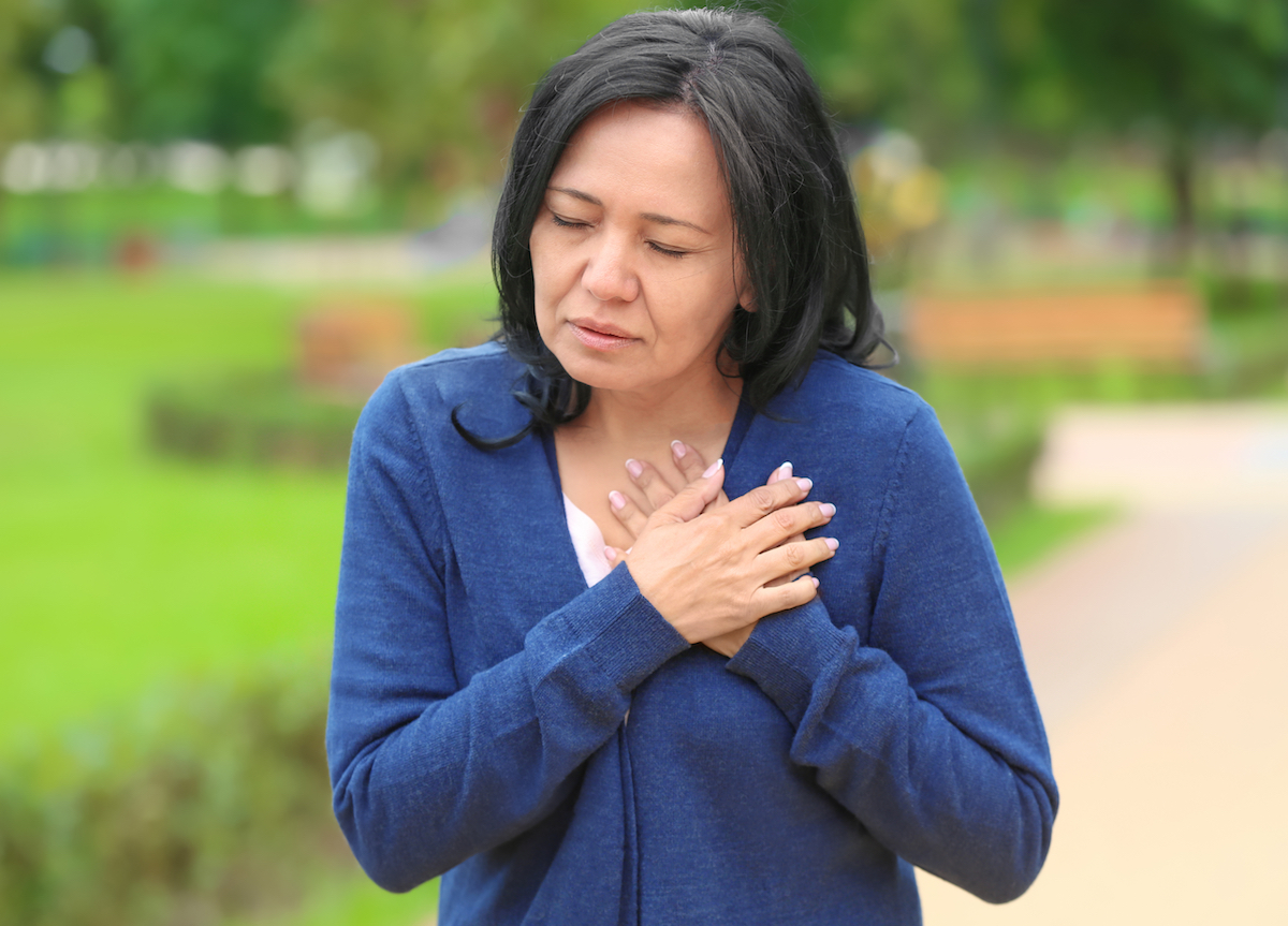 Older asian woman with chest pain