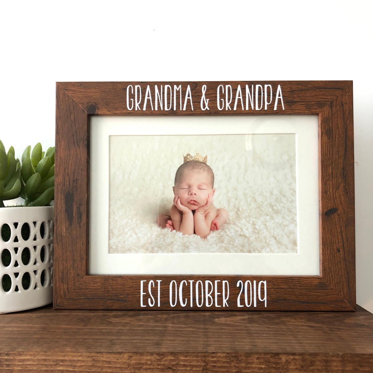 picture of newborn in wooden picture frame, best gifts for grandparents