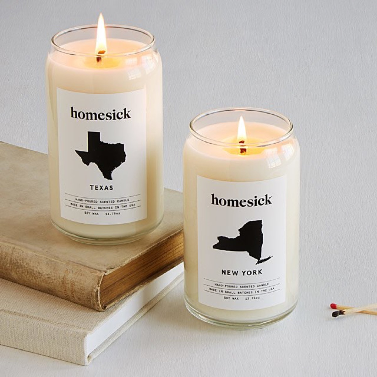 two lit candles in glass jars, best gifts for grandparents