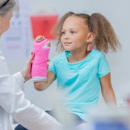 Little Girl at the Doctor's Office with a Broken Arm Health Hazards Kids