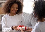 mom giving teenage daughter gift-wrapped box, prepare children for divorce