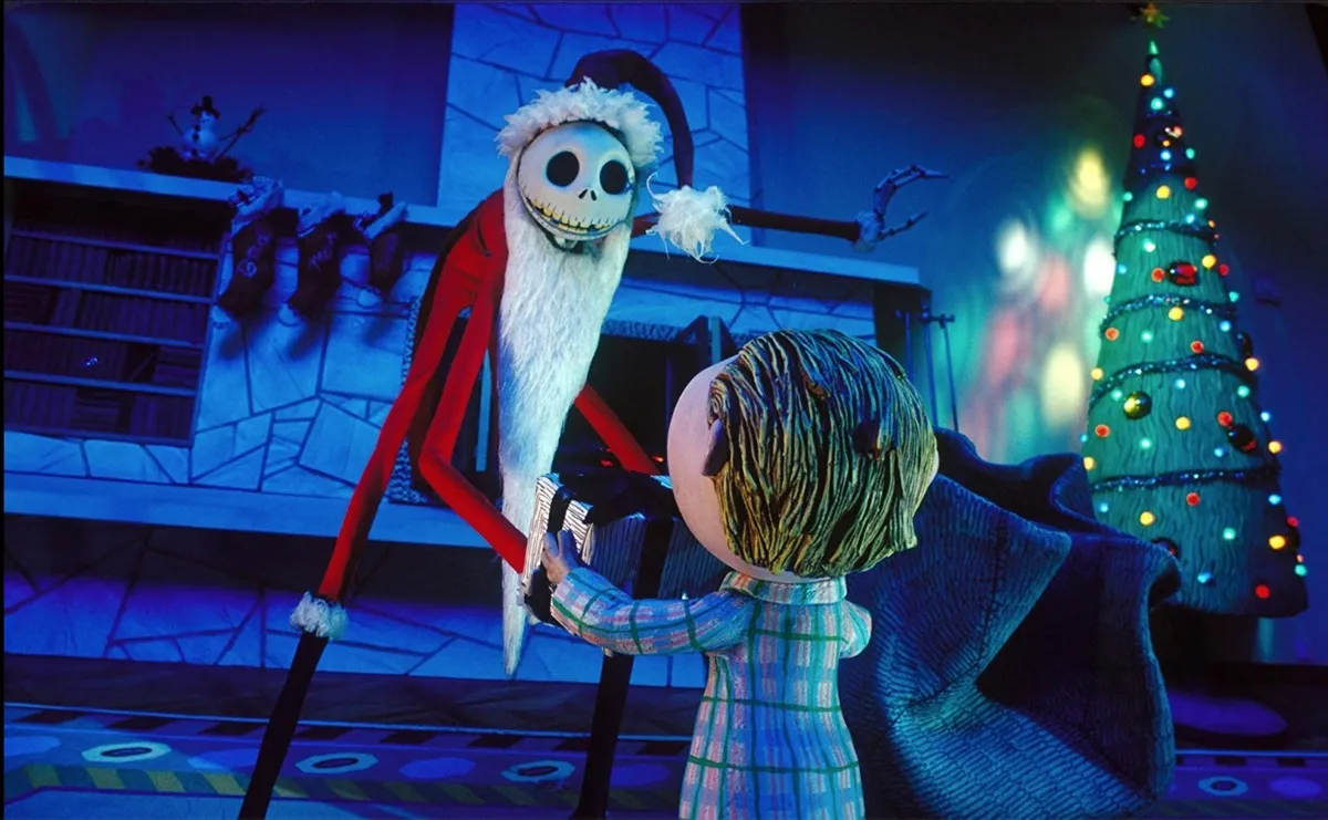 skeleton dressed as santa talking to little kid, nightmare before christmas still, best halloween movies for kids