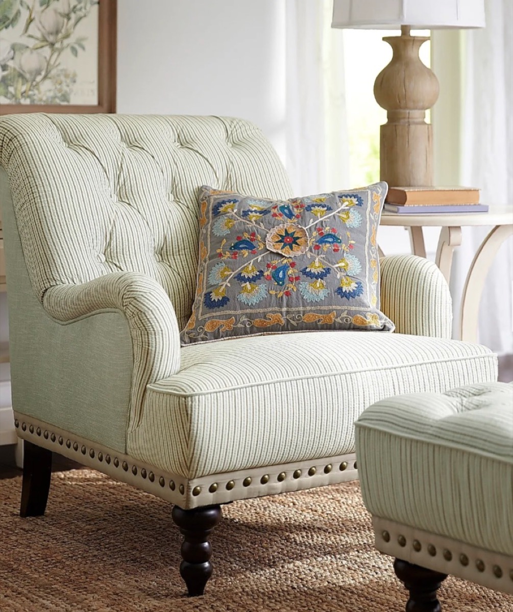 blue and white tufted chair and ottoman