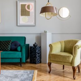 retro living room with green velvet chair and couch
