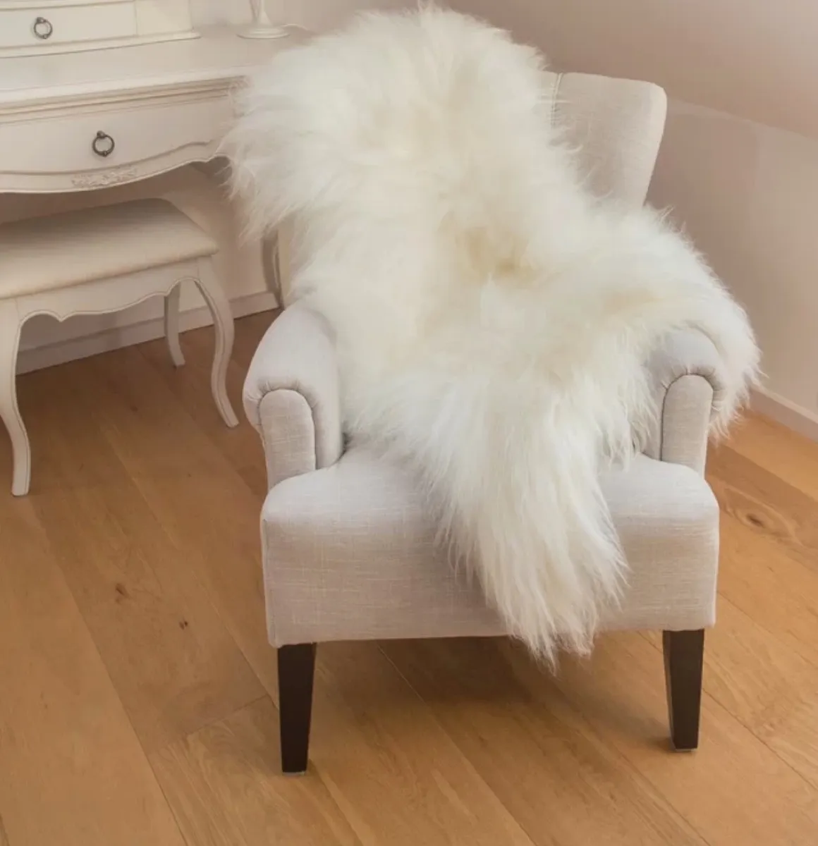 sheepskin rug over chair, old fashioned home items