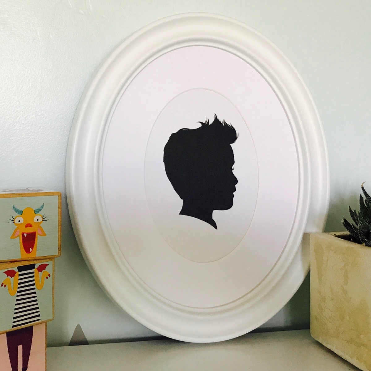 silhouette portrait in white frame, old fashioned home items