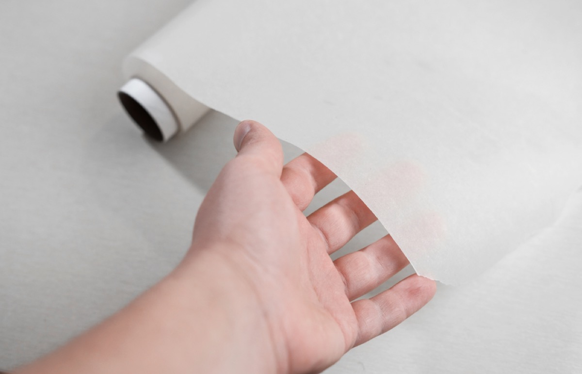 hand under a sheet of wax paper, old fashioned cleaning tips
