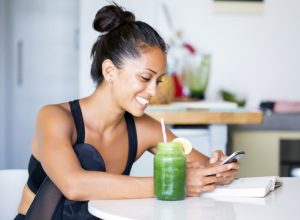 woman drinking green juice, ways to feel amazing