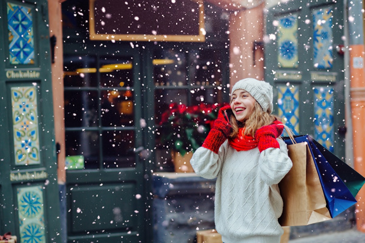 Woman talking on the phone while holiday shopping