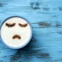 Cappuccino with frown art