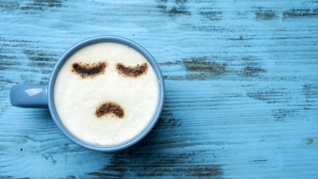 Cappuccino with frown art
