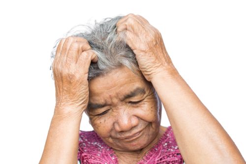 Senior Asian Woman Itches Scalp