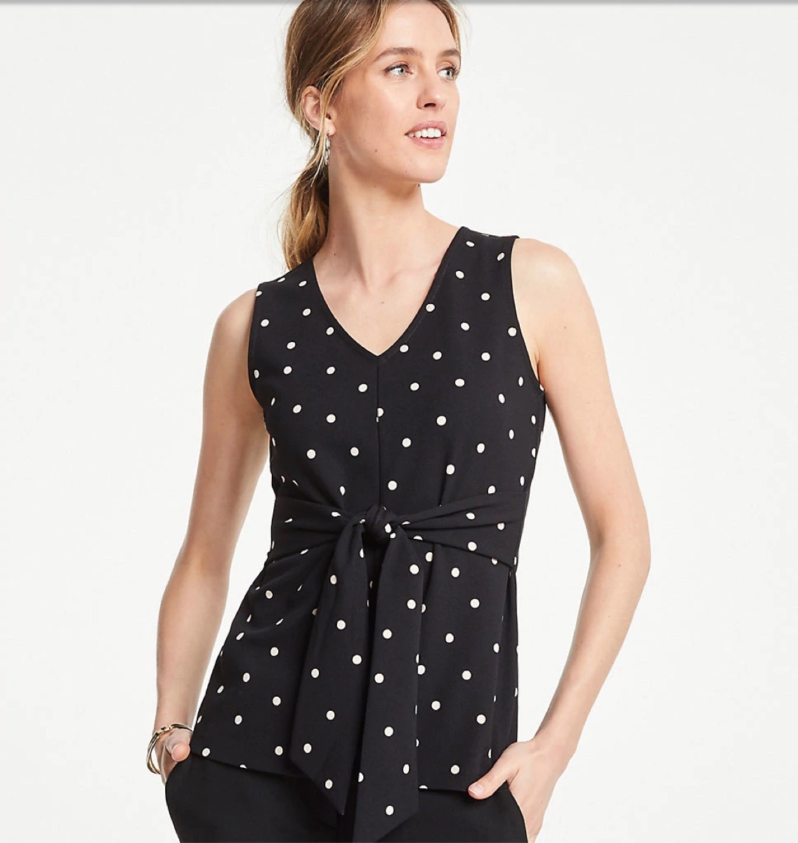 woman wearing black top with white polka dots, end of summer sales 2019