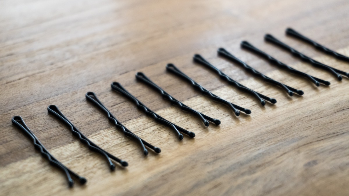 bobby pins on a wooden table, using objects wrong