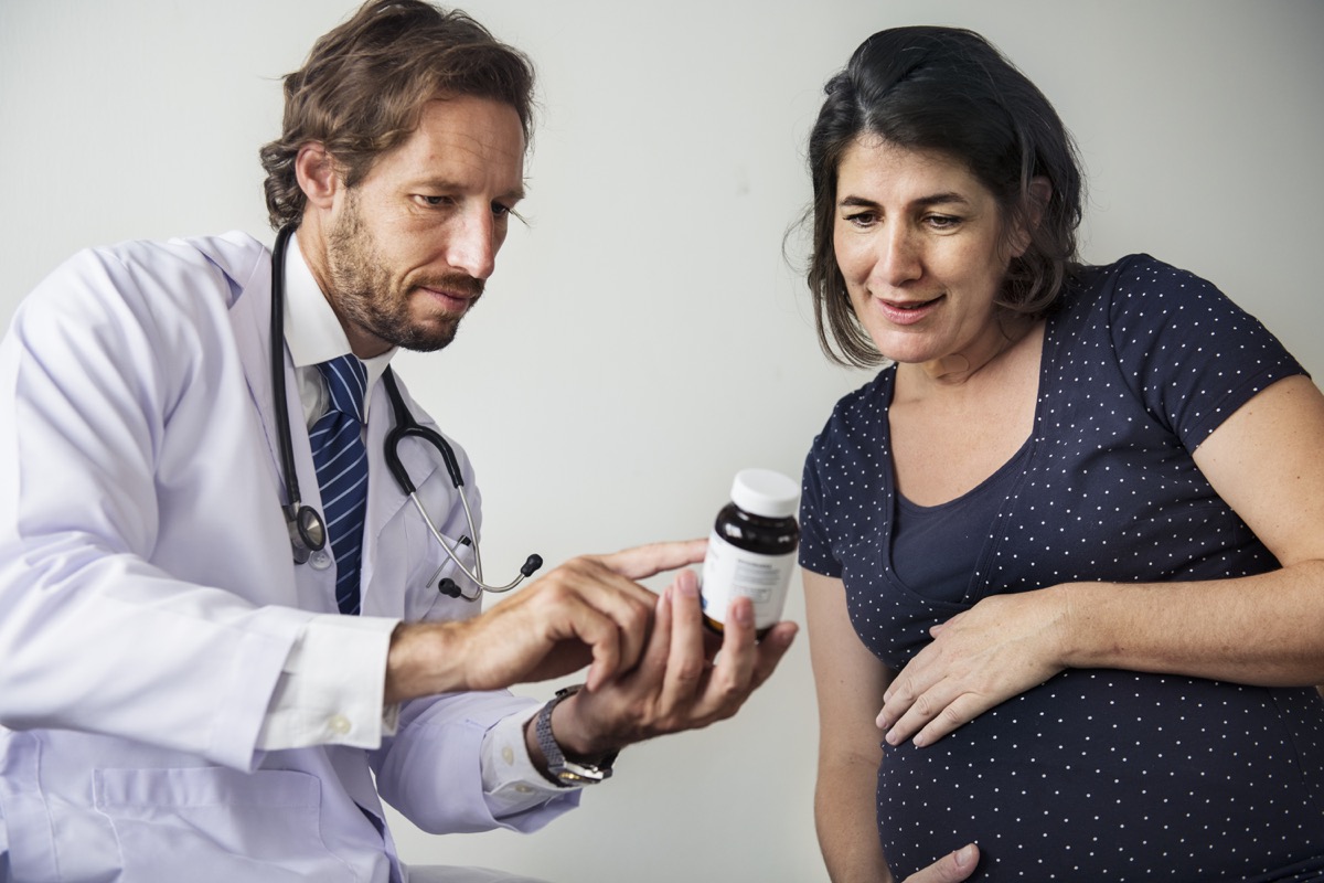 doctor trying to sell vitamins to a pregnant woman