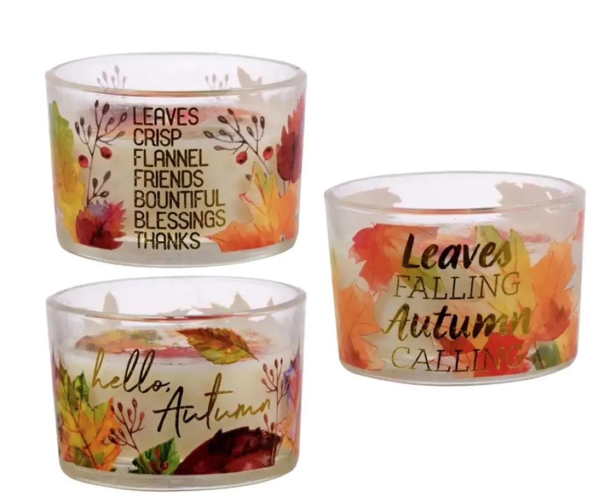 three candles with autumnal prints, dollar store fall decor