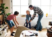 man and two children cleaning living room, earth friendly cleaning products